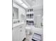 Modern bathroom features a shower and tub combo with a gray and white color scheme at 900 Maclaren N Dr # D, Palm Harbor, FL 34684