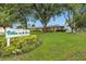 Welcome to Villas on the Green IV, a beautiful community with lush landscaping at 900 Maclaren N Dr # D, Palm Harbor, FL 34684