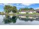 Lovely waterfront home featuring a serene lake view with lush landscaping and a peaceful setting at 900 Maclaren N Dr # D, Palm Harbor, FL 34684
