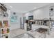 Cozy kitchen with white cabinetry, stainless steel appliances, and modern fixtures at 900 Maclaren N Dr # D, Palm Harbor, FL 34684