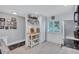Cozy kitchen with white cabinetry, stainless steel appliances, and modern fixtures at 900 Maclaren N Dr # D, Palm Harbor, FL 34684