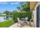 Relaxing patio area perfect for enjoying the serene water views and outdoor dining at 900 Maclaren N Dr # D, Palm Harbor, FL 34684