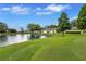 Picturesque water view with lush green surroundings, offering a tranquil setting at 900 Maclaren N Dr # D, Palm Harbor, FL 34684