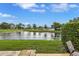 Enjoy picturesque water and golf course views from the property's outdoor space at 900 Maclaren N Dr # D, Palm Harbor, FL 34684