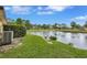 Scenic water views from the backyard, complemented by well-maintained landscaping at 900 Maclaren N Dr # D, Palm Harbor, FL 34684