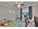 Bright ' bedroom featuring a sign and a large window at 910 E Crenshaw St, Tampa, FL 33604
