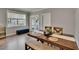 Dining room boasts a wood table with bench seating and lots of natural light at 910 E Crenshaw St, Tampa, FL 33604