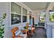 Inviting front porch with rocking chairs and a 'hello' sign, creating a cozy and welcoming entrance at 910 E Crenshaw St, Tampa, FL 33604