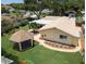 Aerial view of the home, gazebo and yard, showcasing the roof and landscaping at 9951 121St St, Seminole, FL 33772