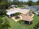 Aerial view of property featuring a landscaped yard, swimming pool and gazebo at 9951 121St St, Seminole, FL 33772
