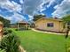 Spacious backyard with a gazebo, lush green grass, walkway, and well-kept landscaping at 9951 121St St, Seminole, FL 33772
