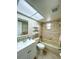 Neutral colored bathroom featuring a shower-tub combo and a skylight for natural illumination at 9951 121St St, Seminole, FL 33772