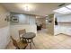 View of breakfast area with table and chairs adjacent to the kitchen and living space at 9951 121St St, Seminole, FL 33772