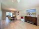 Dining area featuring tile floors, a chandelier, a round table with chairs, and artwork on the walls at 9951 121St St, Seminole, FL 33772