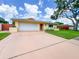 Charming single Gathering home with tile roof, two car garage and mature landscaping at 9951 121St St, Seminole, FL 33772