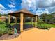 Charming gazebo set in a lush backyard, perfect for outdoor relaxation and entertaining at 9951 121St St, Seminole, FL 33772