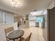 Open kitchen and dining area with stainless steel appliances and a cozy breakfast nook at 9951 121St St, Seminole, FL 33772