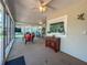 Relaxing sunroom featuring views of the backyard, lots of windows, and ample seating at 9951 121St St, Seminole, FL 33772
