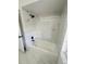 Bathroom with new bathtub, shower and marble tiled walls at 10444 Fordham St, Spring Hill, FL 34608