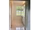 Bright bathroom features white cabinets, marble floors, and a large window at 10444 Fordham St, Spring Hill, FL 34608
