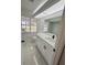 Updated bathroom with new fixtures, marble floors, and great natural light at 10444 Fordham St, Spring Hill, FL 34608