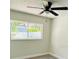 Bedroom featuring modern vinyl floors, fan, and window at 10444 Fordham St, Spring Hill, FL 34608