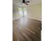 Bright bedroom with gray flooring, two windows and a ceiling fan at 10444 Fordham St, Spring Hill, FL 34608