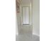Hallway featuring polished marble flooring and neutral paint at 10444 Fordham St, Spring Hill, FL 34608