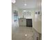 Kitchen with modern appliances, marble floors and view of the pool area at 10444 Fordham St, Spring Hill, FL 34608