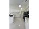 Modern kitchen with white cabinets, stainless steel appliances, and elegant lighting at 10444 Fordham St, Spring Hill, FL 34608