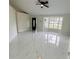 Bright living area featuring polished marble flooring, a bay window, and natural light at 10444 Fordham St, Spring Hill, FL 34608