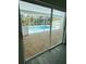 View of a screened in swimming pool with light blue trim from the lanai at 10444 Fordham St, Spring Hill, FL 34608