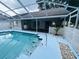 Sparkling swimming pool and covered lanai perfect for outdoor entertaining at 10444 Fordham St, Spring Hill, FL 34608