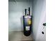 Classic Rheem water heater against white walls at 10444 Fordham St, Spring Hill, FL 34608