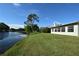 Spacious backyard with a serene lake view, providing a tranquil setting at 10921 Brightside Dr, Tampa, FL 33624