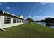 Backyard view of pond with lush green grass at 10921 Brightside Dr, Tampa, FL 33624