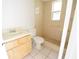 Bathroom showcasing a walk-in shower, safety bar, and vanity at 10921 Brightside Dr, Tampa, FL 33624