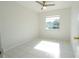 Empty bedroom with tile flooring and a single window with a view of the neighborhood lake at 10921 Brightside Dr, Tampa, FL 33624
