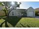 Charming single-story home with a well-manicured lawn and mature trees at 10921 Brightside Dr, Tampa, FL 33624