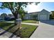 A single-story home with an attached garage and a well-manicured front yard at 10921 Brightside Dr, Tampa, FL 33624