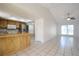An open-concept space showcases the kitchen and living room with tile flooring at 10921 Brightside Dr, Tampa, FL 33624