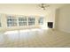 Spacious living area featuring tile floors, a fireplace, and abundant natural light from large windows at 10921 Brightside Dr, Tampa, FL 33624