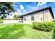 Lush backyard with well-maintained lawn, privacy fence, and comfortable outdoor living space at 11011 Little Blue Heron Dr, Riverview, FL 33579