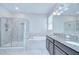 Bathroom showcasing a large shower, soaking tub, and double vanity with granite countertop at 11011 Little Blue Heron Dr, Riverview, FL 33579