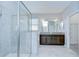 Spacious bathroom featuring a glass shower and double vanity with granite countertop at 11011 Little Blue Heron Dr, Riverview, FL 33579