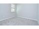 Bright bedroom with a window and outlets at 11011 Little Blue Heron Dr, Riverview, FL 33579