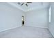 Spacious carpeted bedroom leading to en suite bathroom at 11011 Little Blue Heron Dr, Riverview, FL 33579