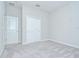 This bedroom has a closet and off white walls at 11011 Little Blue Heron Dr, Riverview, FL 33579
