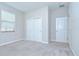 The bedroom has a closet and window at 11011 Little Blue Heron Dr, Riverview, FL 33579