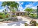 Beautiful clubhouse exterior with landscaped entrance and inviting walkway at 11011 Little Blue Heron Dr, Riverview, FL 33579